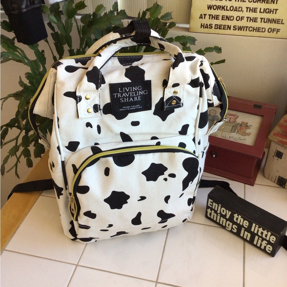 ‘Living Traveling Share’ Canvas Cow Print Backpack - Picture 2 of 8